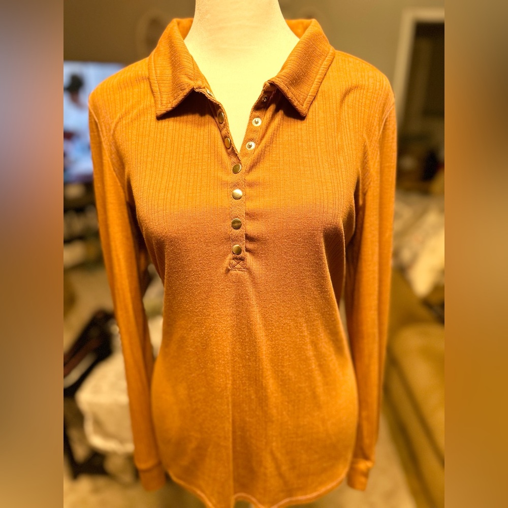 Long sleeve collar silver snap button ribbed top. Dark mustard in color.